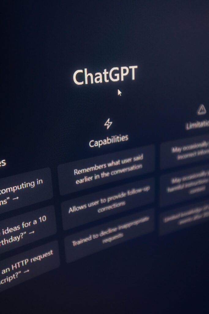 Vertical shot of ChatGPT interface on screen highlighting AI capabilities.